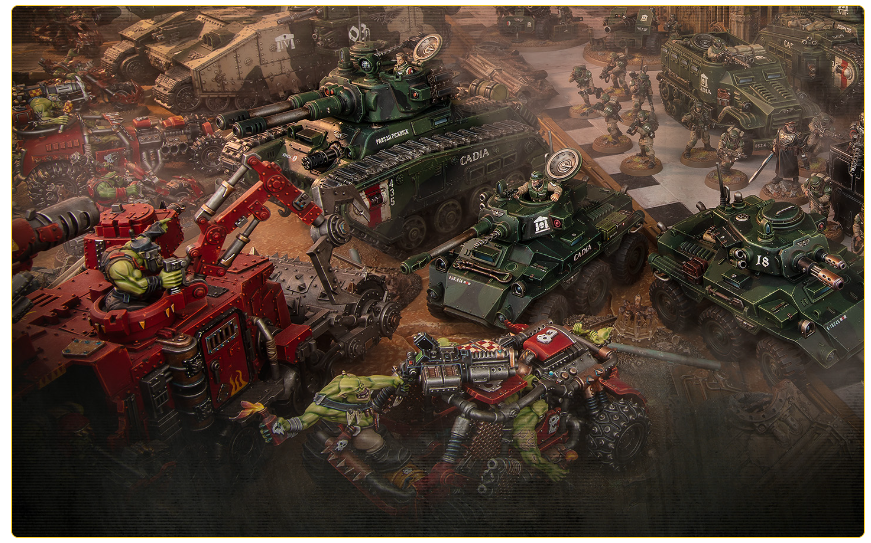 Tabletop war game scene with green orc figures attacking armored tanks on a dusty battlefield.