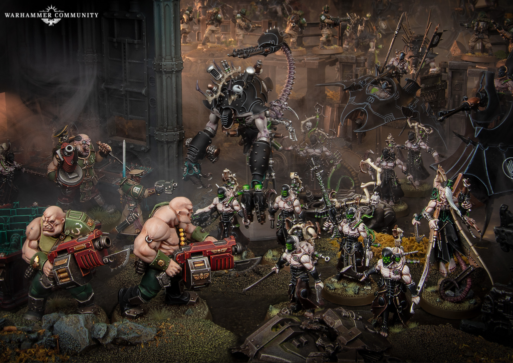 Ork warboss and clashing figures in a dense tabletop battle among ruined industrial ruins; hordes of warriors fight across multiple levels with sci‑fi weaponry and banners.