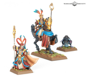 Three Warhammer miniatures: a mounted armored rider with blue cloak and ornate lance, a staff-wielding sorcerer, and a squat, robed beast on grassy bases, with the Warhammer Community logo in the corner.