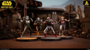 Four Star Wars Shatterpoint action figures posed with blasters in a ruined industrial setting, with logos in the corners.