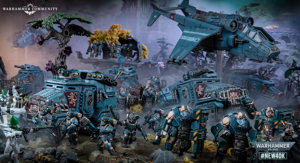Teal Warhammer 40K battle scene with numerous armored tanks, infantry, and a hovering aircraft amid smoke and ruins.