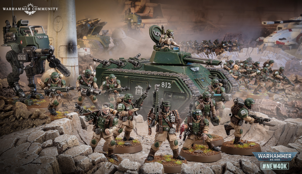 Green-armored Warhammer 40K troops advance with tanks and walkers amid rubble; logo reads Warhammer Community in the corner.