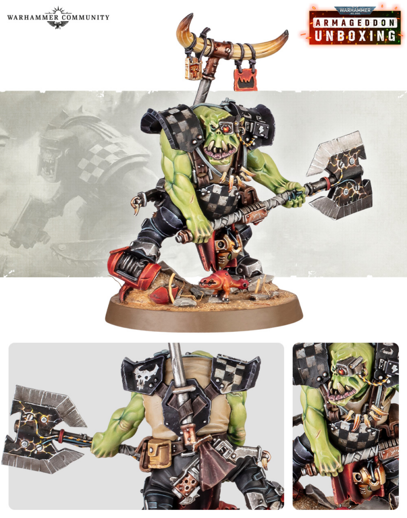 Orc Warhammer miniatures figure posing with a double-headed axe on a textured base, from the Armageddon Unboxing feature