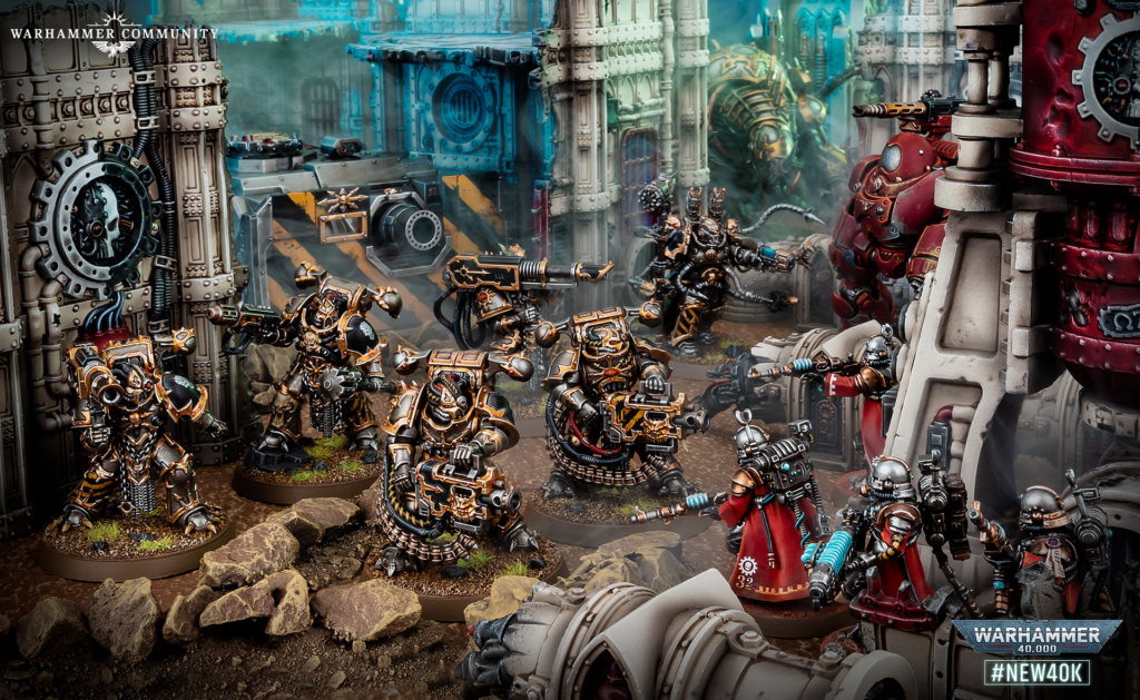 Ork and Space Marine battle scene in a ruined industrial diorama with detailed models and terrain pieces.
