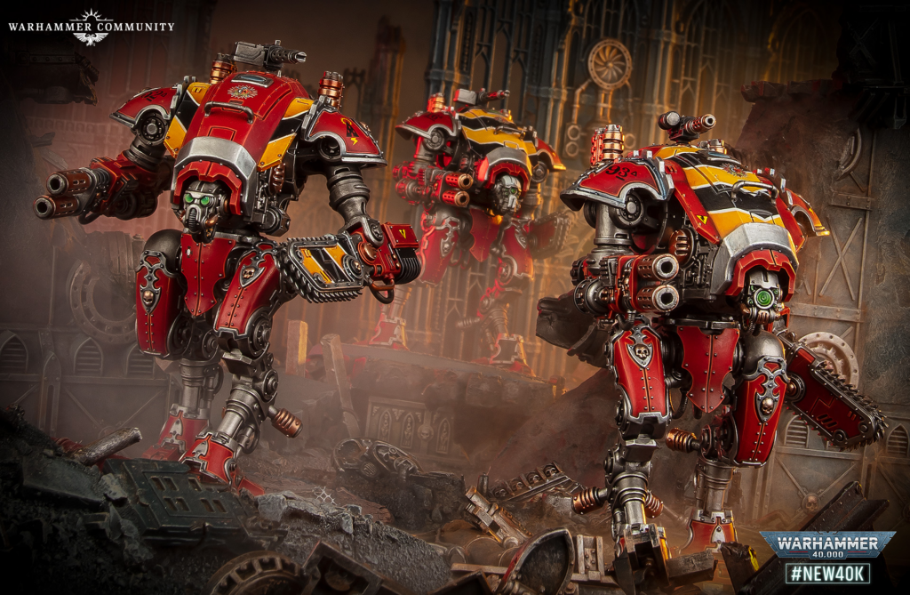 Three red and yellow Warhammer 40,000 battle walkers clash in a ruined industrial cityscape, foreground rubble visible