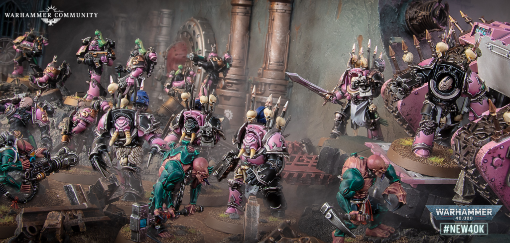 Warhammer 40k tabletop battle with pink-armored Space Marines clashing with green Orks amid ruined industrial debris; Warhammer Community branding visible.