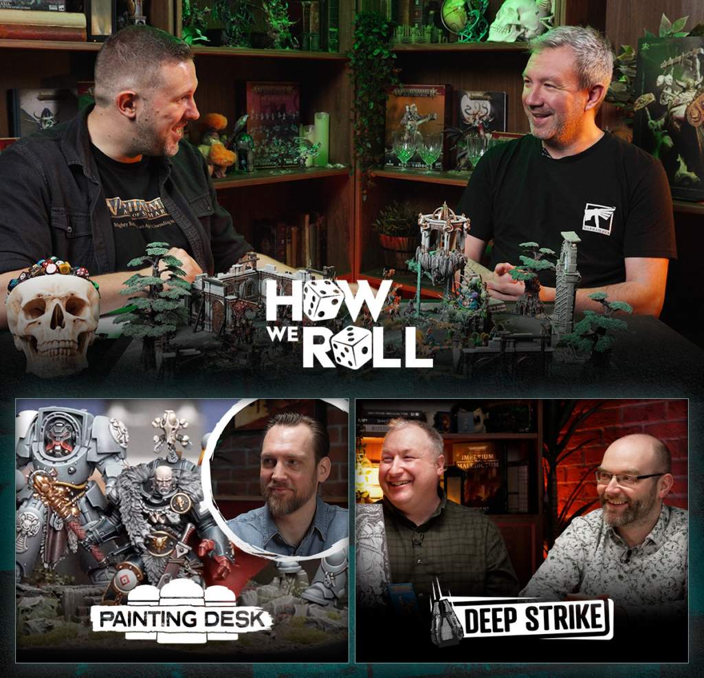 Two men sit across a table filled with miniature Warhammer terrain pieces and figurines, smiling at each other with a decorative skull on the left and a prominent 'How We Roll' logo in the center.