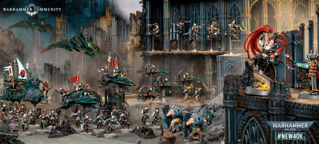 Warhammer 40,000 tabletop battle with flying jetbikes, infantry, and ruined gothic cathedral walls, Warhammer Community logo in corner.