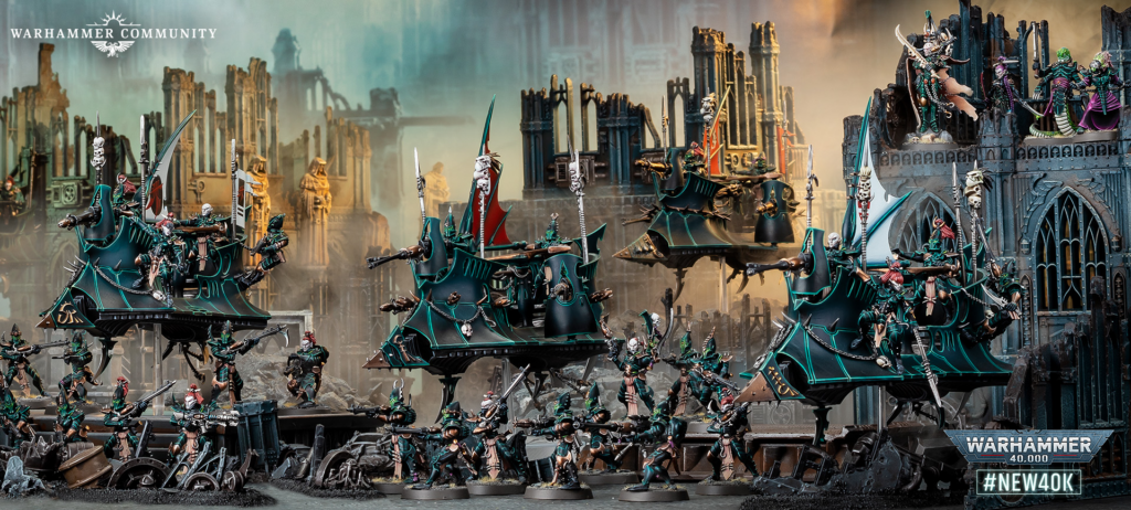 Warhammer 40,000 battle scene with teal war ships and troops clashing in a ruined gothic city, Warhammer Community branding in the corner topright-left.
