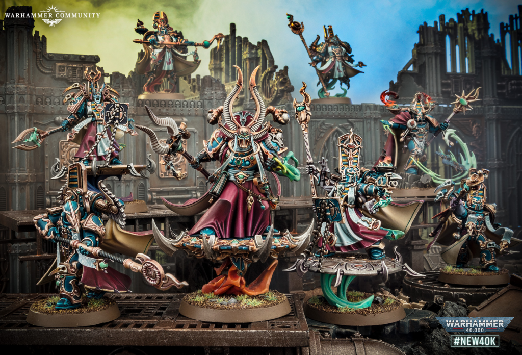 image Frontline Gaming Group of ornate Warhammer 40,000 miniatures on a ruined fortress diorama, with a central horned lord in a magenta cloak surrounded by armored foes.