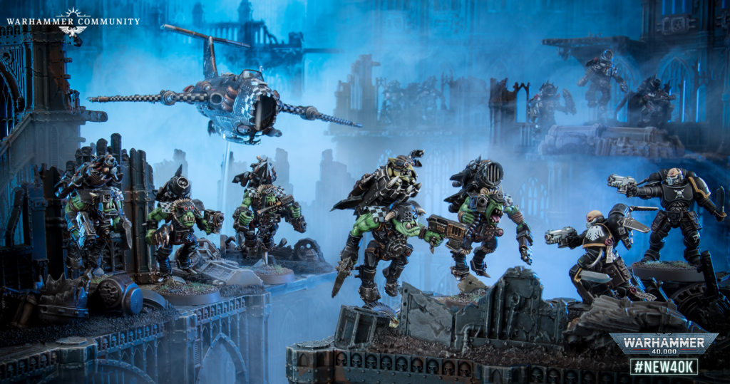 Warhammer 40,000 diorama: orc warriors clash with armored humans on a ruined gothic bridge, blue fog and a hovering gunship overhead.