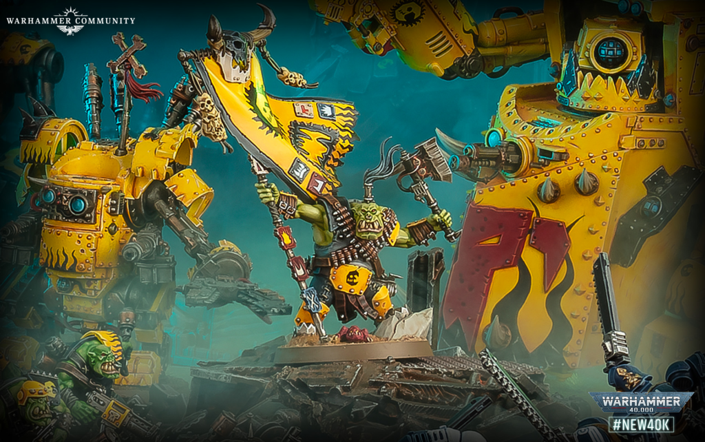 image Frontline Gaming Ork warboss leading a yellow banner into battle against a massive yellow tank in a chaotic sci‑fi fight scene.