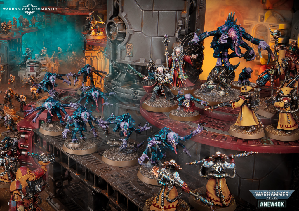 Warhammer diorama showing a multi‑level battle with many painted miniatures and a large purple Tyranid on the right.