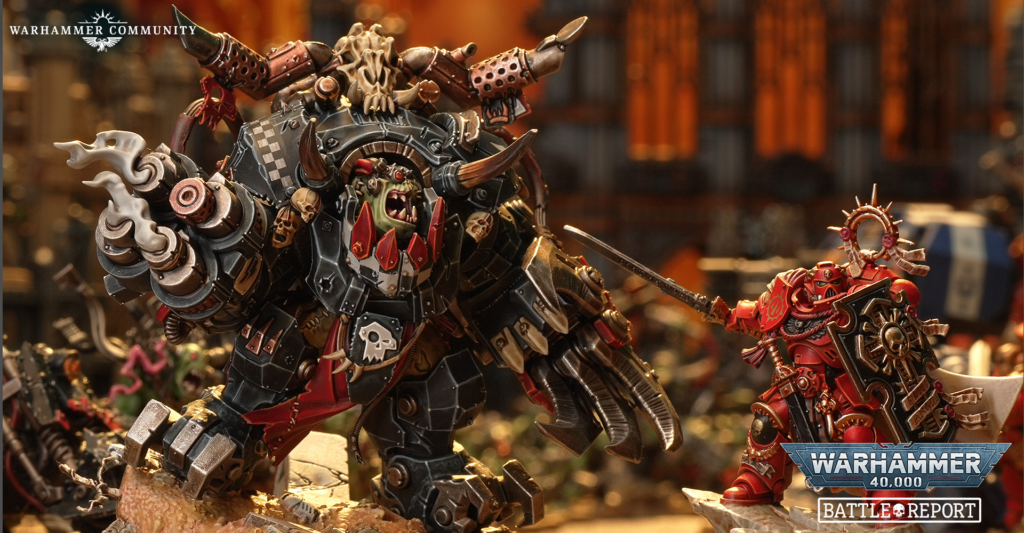 Warhammer diorama showing a large armored Ork looting a battle scene next to a red Space Marine figure, with logos in the corner (Warhammer Community, Battle Report).