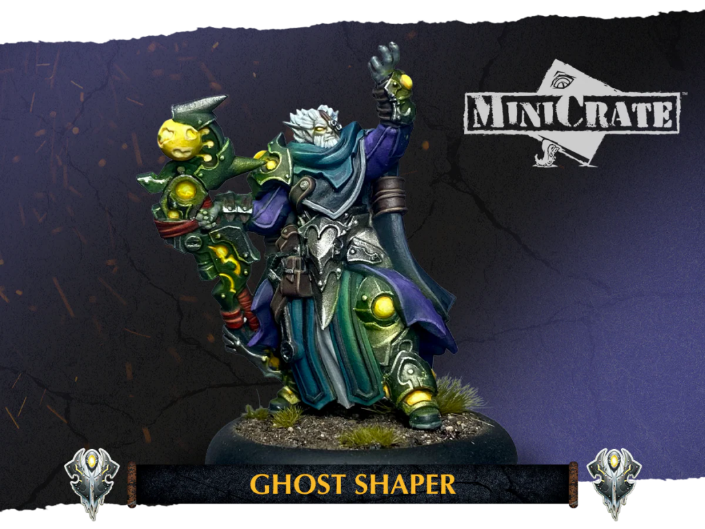 Painted fantasy miniature of a wizard-like figure wielding a glowing staff, titled 'Ghost Shaper' from MiniCrate on a textured base with banner text below.