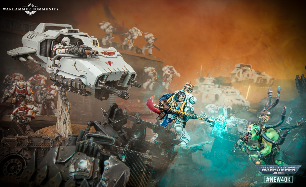 Warhammer 40K battle scene with a large white armored vehicle firing amid ruined terrain and space Marines; branding in corner.
