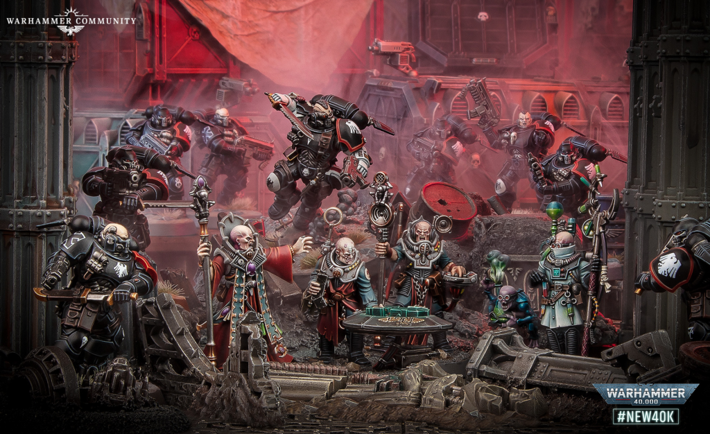 Warhammer 40,000 battle diorama with Space Marines and Chaos troops clashing in a ruined industrial scene; Warhammer Community logo top left.