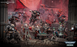 Warhammer 40,000 battle diorama with Space Marines and Chaos troops clashing in a ruined industrial scene; Warhammer Community logo top left.