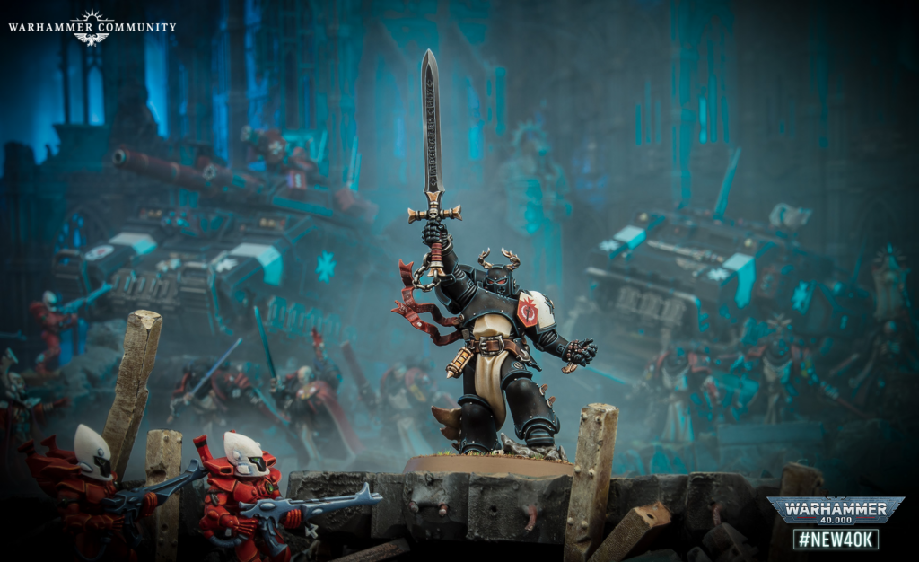Front-and-center armored warrior raises a large sword amid a ruined battlefield; blue glow and Warhammer branding in the background.