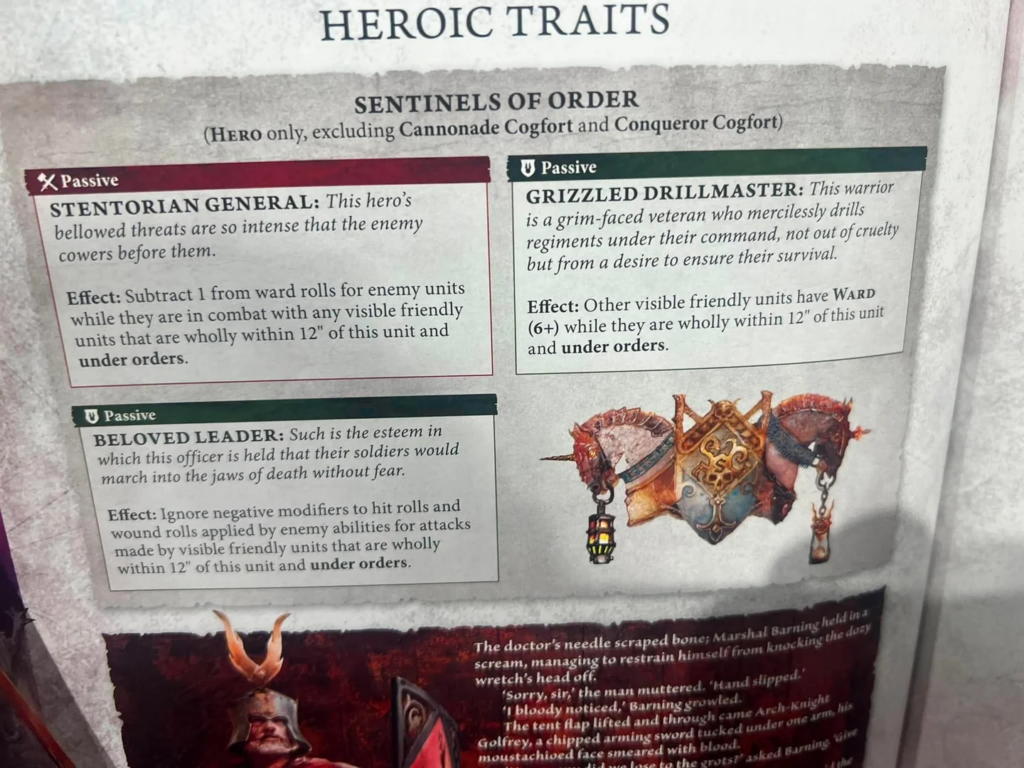 Page from a game manual titled Heroic Traits, showing three trait panels labeled Stentorian General, Grizzled Drillmaster, and Beloved Leader with an emblem on the right side.
