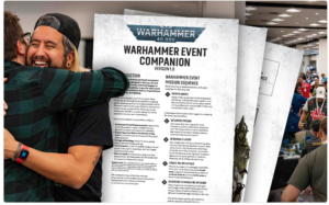 Two people hug in front of a Warhammer Event Companion sheet at a convention near a busy expo floor.