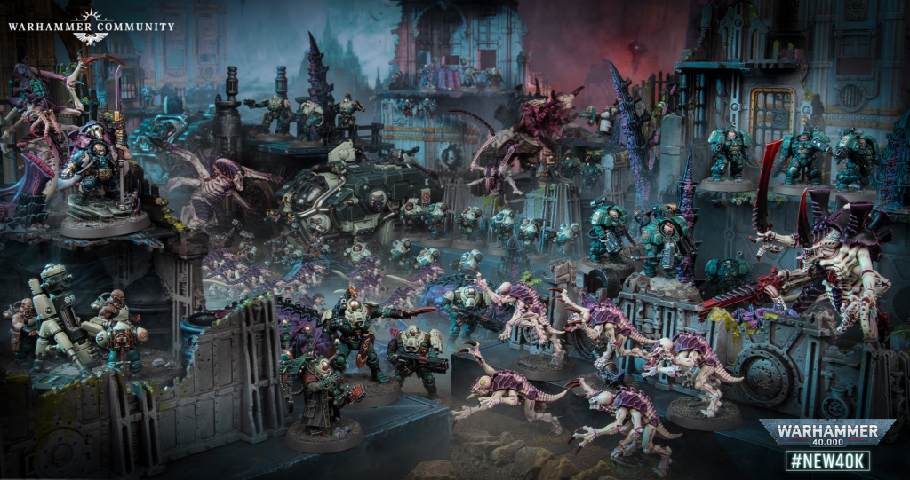 image Frontline Gaming Epic Warhammer 40,000 diorama: Marines clash with Tyranids amid a ruined cityscape; Warhammer Community logo top left.