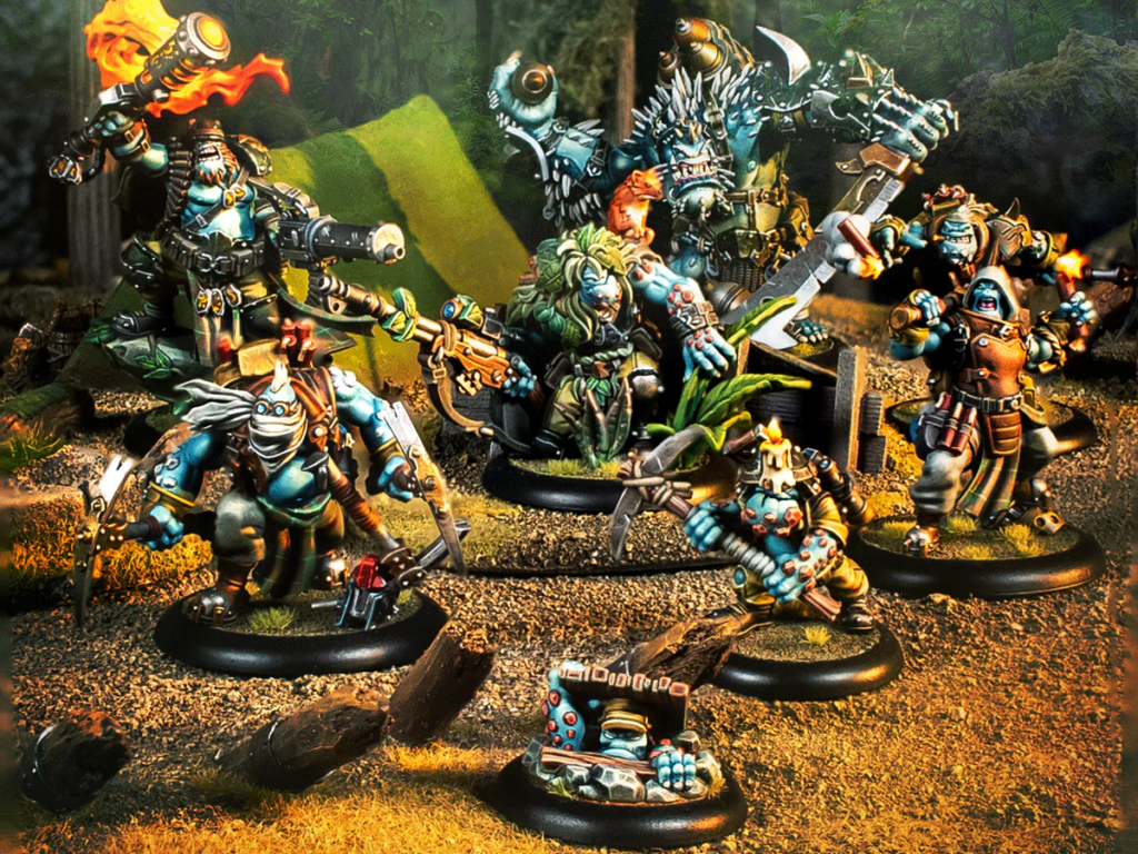 Tabletop fantasy battle scene with armored orc miniatures posed on round bases in a wooded diorama