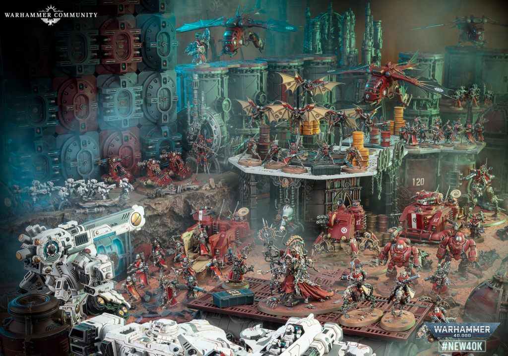 Extensive Warhammer 40,000 battle diorama with flyers, armored units, and infantry on a multi-level industrial battlefield.