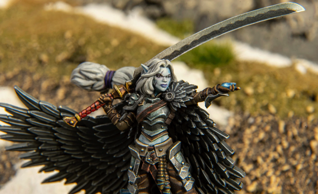 image Frontline Gaming Winged fantasy warrior statue with black feathered wings, silver armor, and a raised curved sword.