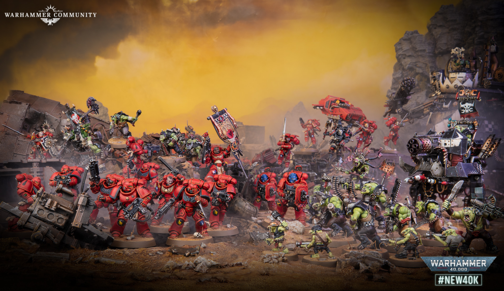 Epic Warhammer 40,000 battle scene with red Space Marines clashing with orcs amid wreckage and yellow smoke; Warhammer Community logo top-left.