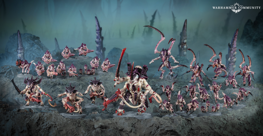 Horde of purple alien miniatures advancing across a rocky, desolate battlefield with a Warhammer Community logo in the top-right.