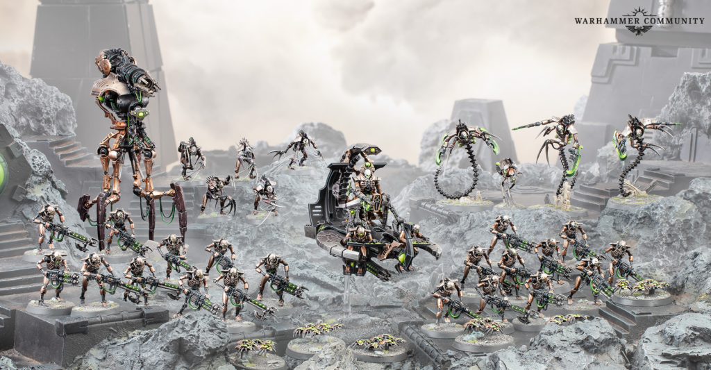 Warhammer tabletop battle scene with copper and black armored miniatures fighting on a rocky, cratered battlefield; glowing green energy weapons abound.