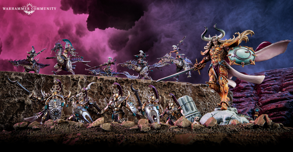 Epic Warhammer battle on a rocky cliff under a pink–purple sky; ornate armored figures clash.",