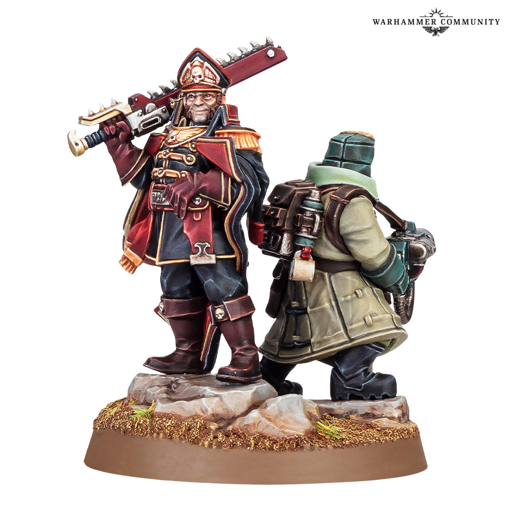 image Frontline Gaming Warhammer miniatures: a red-uniformed commander with a large rifle and a green-clad ally with a backpack stand on a rocky base, Warhammer Community logo in corner.