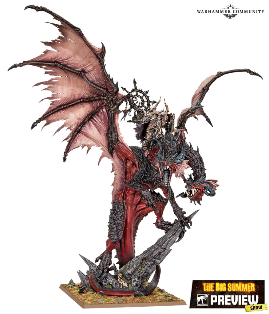 Winged red dragon miniature with an armored rider perched on a rocky base, from Warhammer.