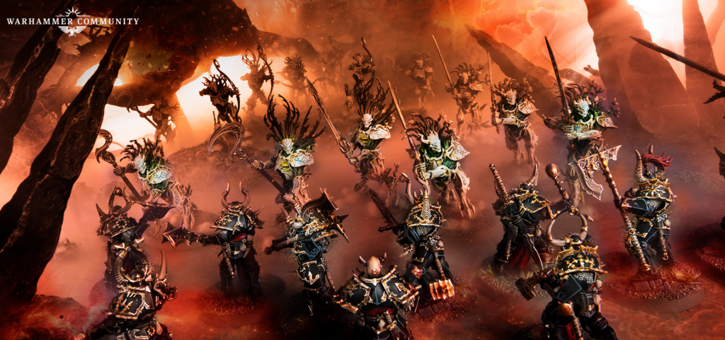Fiery battlefield with armored warriors clashing against skeletal demonic figures amid lava; Warhammer Community logo in the top-left corner.