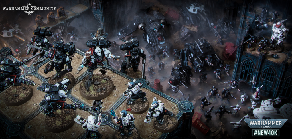 Warhammer 40,000 battle scene on a ruined fortress battlement with space marines advancing and smoke in the air, logo in the corner.