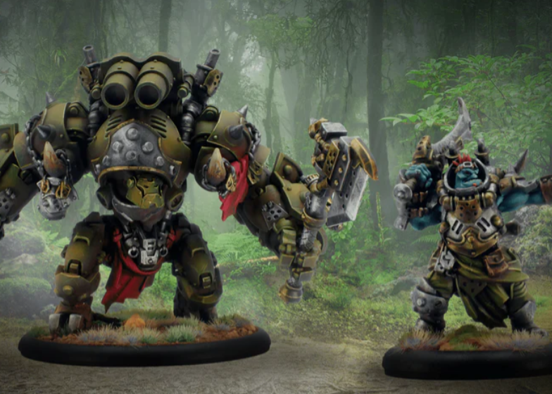 Screenshot 20260722 093231 Frontline Gaming Two heavily armored orc miniatures posed in a misty forest one towering with a giant hammer the other wielding a spiked weapon on a round base