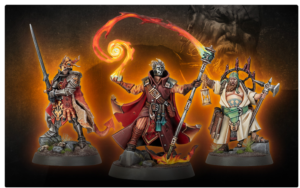 Three fantasy miniature figures on bases: a armored left warrior with sword, a red-cloaked center spellcaster conjuring fire, and a right bearded mage with staff and lantern, glow behind them.