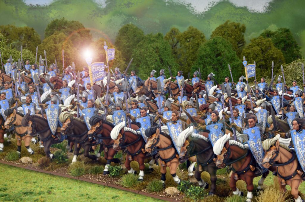 Massive line of armored medieval cavalry riders with blue shields charging across a meadow sun glare in the background