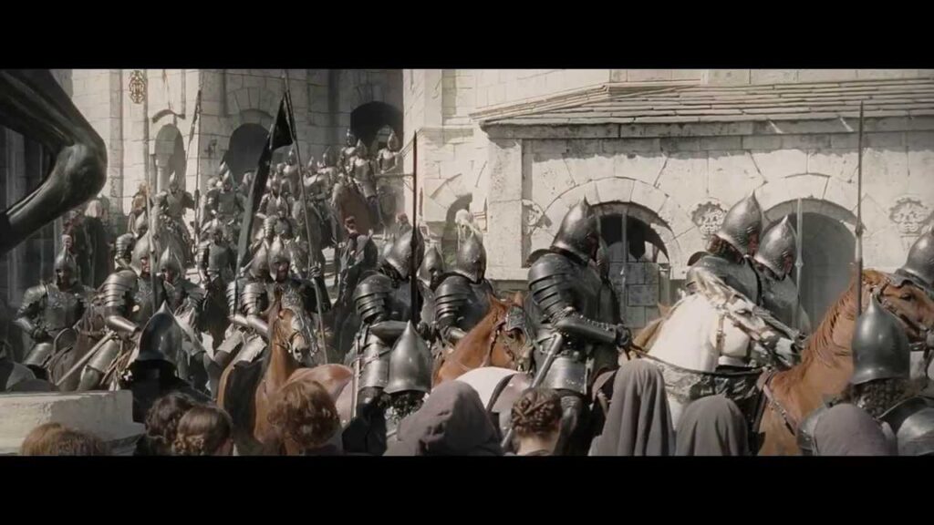 Mounted knights in full plate armor ride through a stone fortress crowds watching the charge