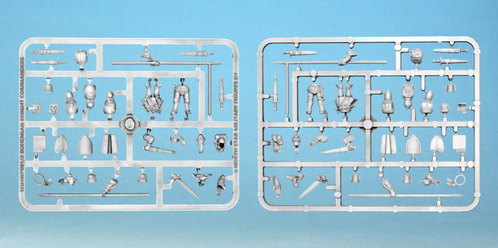 Two plastic model kit sprue frames filled with tiny metal looking parts and miniatures on a blue background ready to assemble
