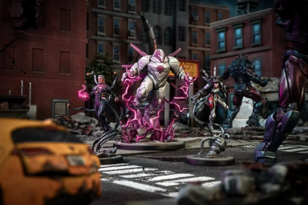 Action figure battle in a ruined city street with a large pink-energy robot center stage and smaller villains surrounding it on circular bases, debris all around.
