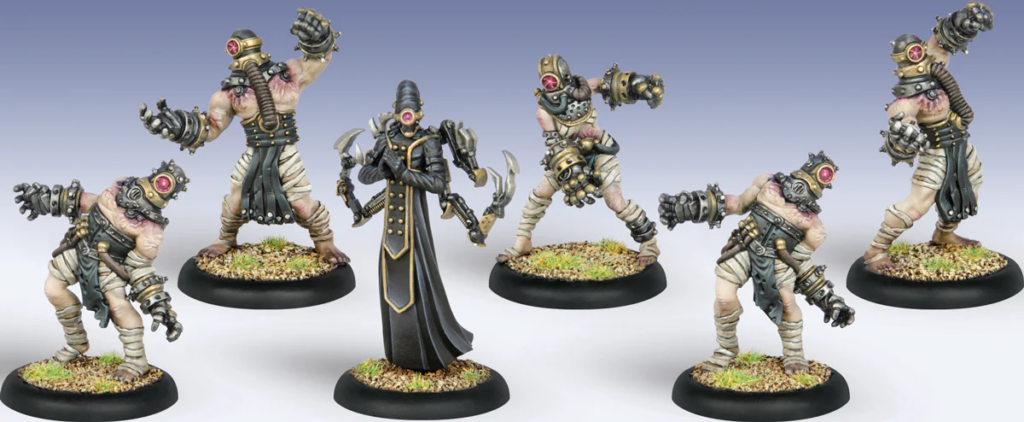 Six painted fantasy miniatures on round bases a central dark cloaked necromancer flanked by five gas masked zombie enforcers