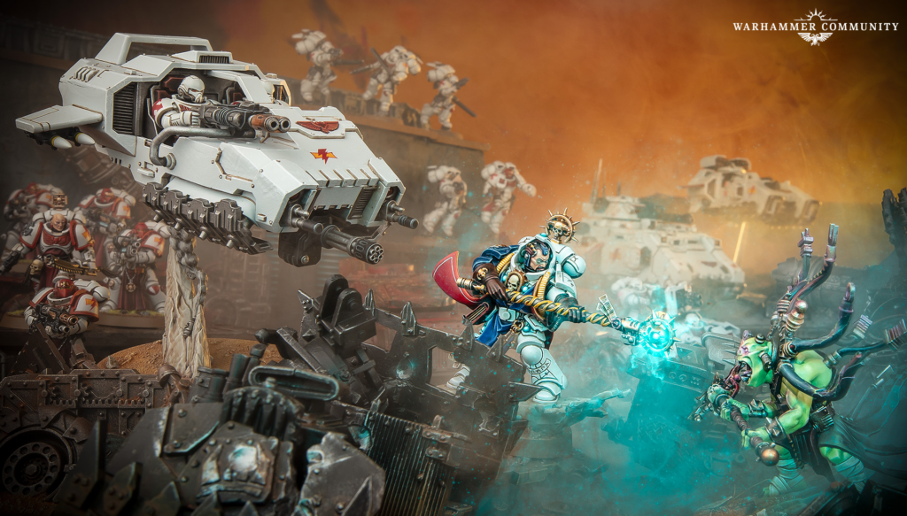 Warhammer battle scene with a white armored vehicle firing in the foreground while blue armored hero and green foes clash amid orange smoke