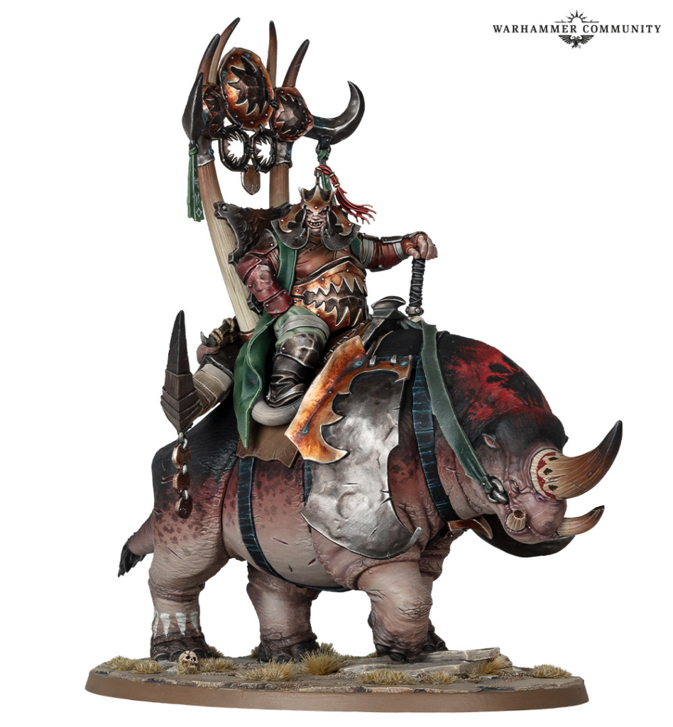 Warhammer miniature a heavily armored rider with horned helmet mounted on a armored rhinoceros like beast with large tusks and war gear