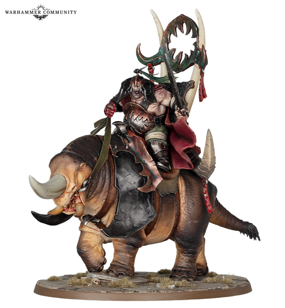 Warhammer miniature armored warrior riding a large tusked boar with a circular green weapon on a textured base