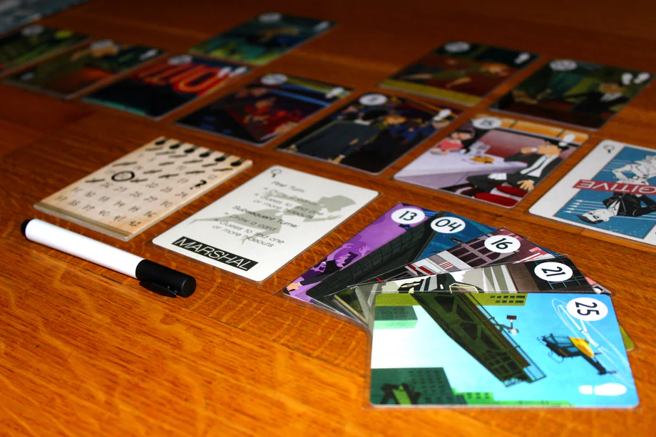 image Frontline Gaming Tabletop board game in progress with colorful numbered cards and a white marker on a wooden table