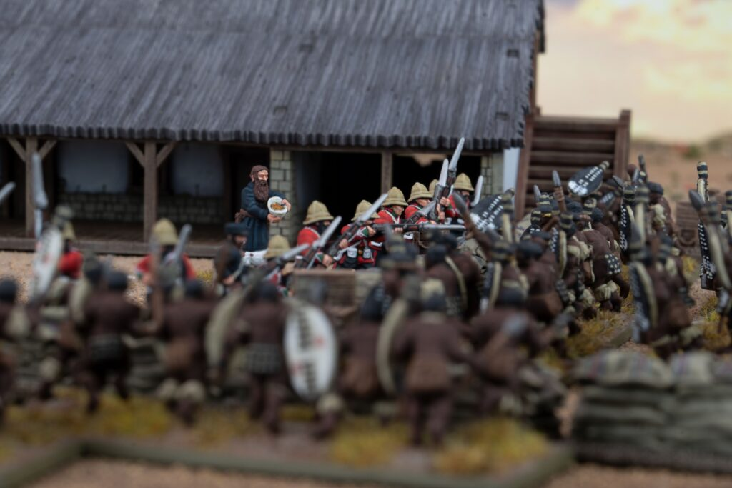 image Frontline Gaming Miniature battle scene with numerous toy soldiers advancing toward a man standing by a rustic barn