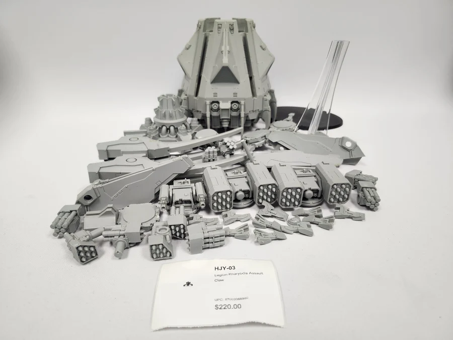 image Frontline Gaming Grey plastic sci fi tank and weapon model display on a white surface with a price tag nearby